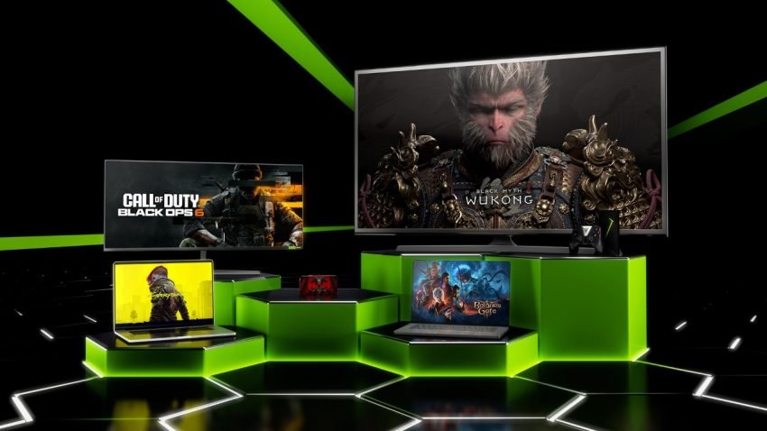 A promotional image showcasing various gaming devices including a large TV screen displaying Black Myth: Wukong, a monitor showing Call of Duty: Black Ops 6, two laptops with different games, and a handheld console, all arranged on glowing green hexagonal platforms against a black background with green light accents.