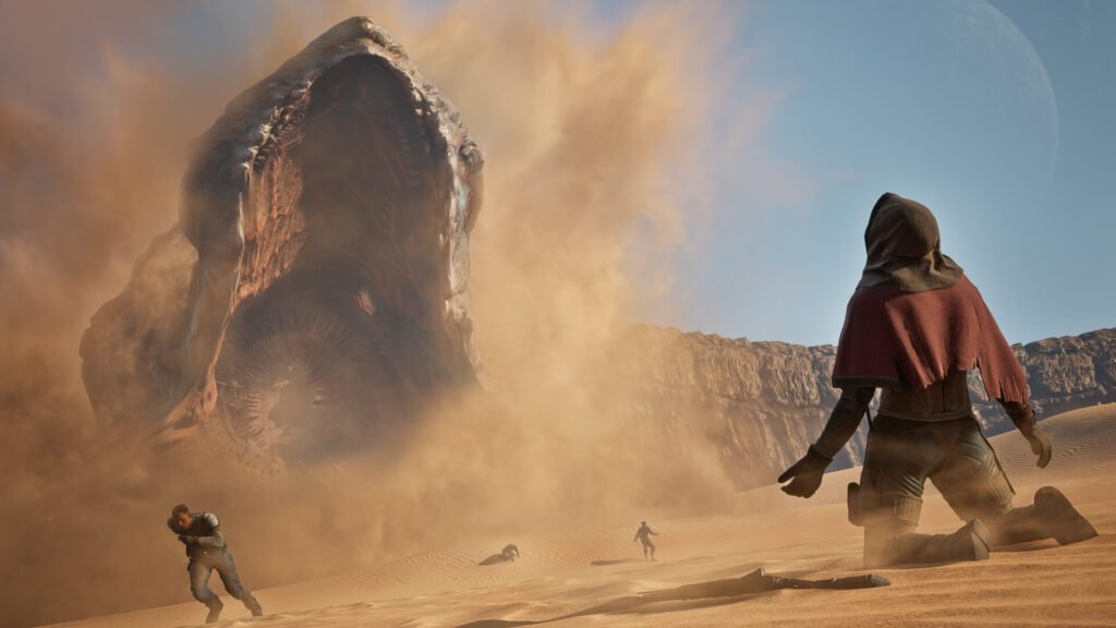 A dramatic screenshot from Dune: Awakening, showing a sand worm rising from the desert sands, kicking up a massive dust cloud, as several human figures react in the foreground.
