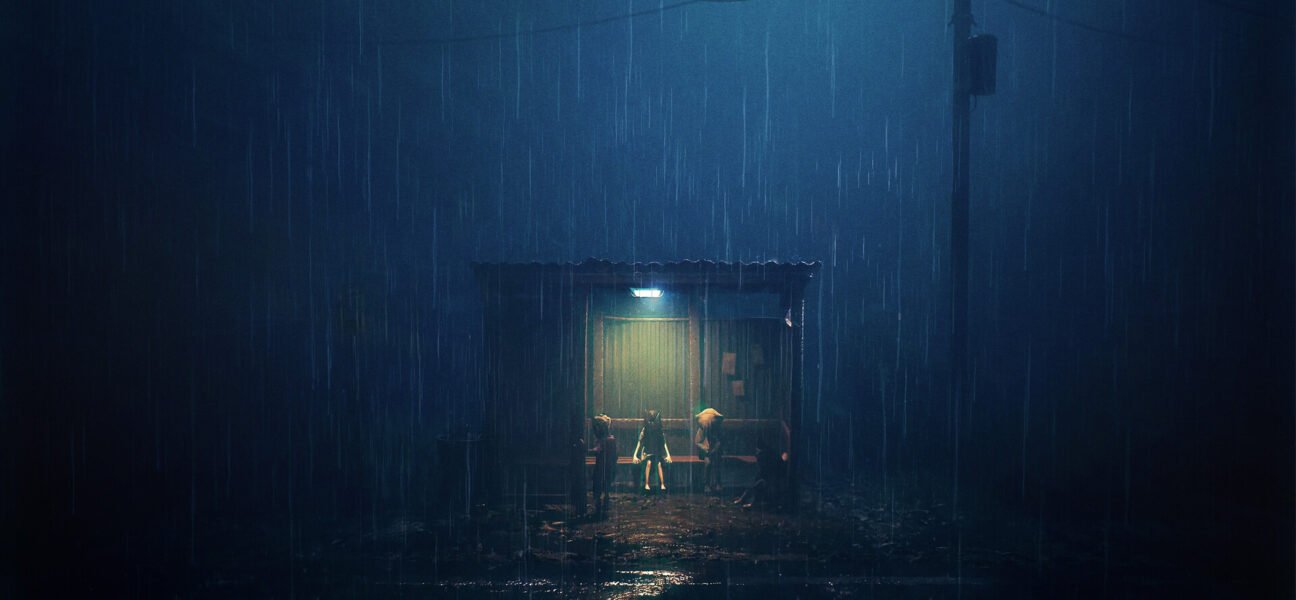 Three children sit under a small shelter at night during heavy rain, lit by a single lamp.